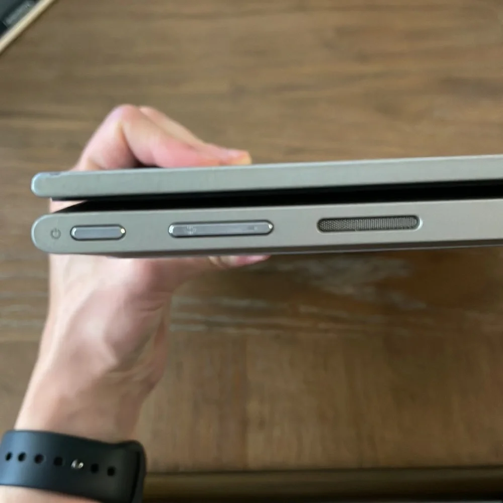 Silver Dell laptop that folds over to a tablet